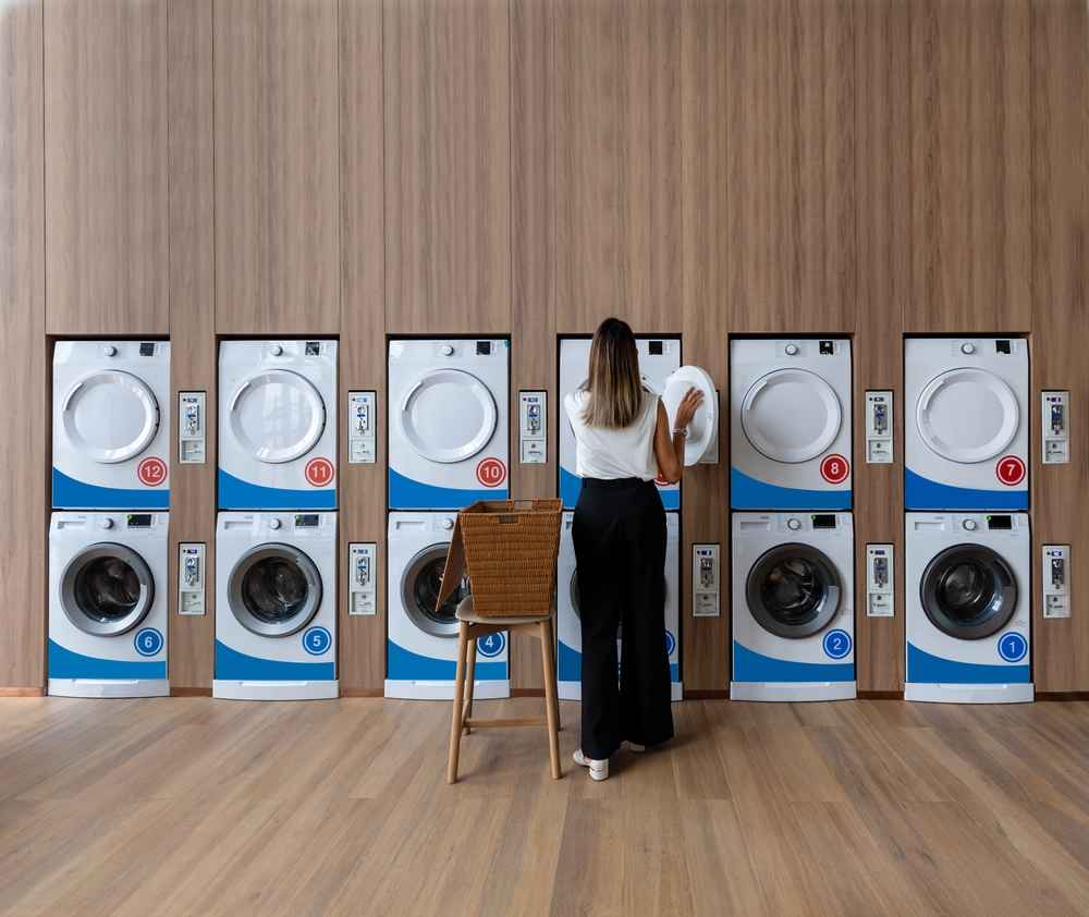 How a tumble dryer works woman in laundary