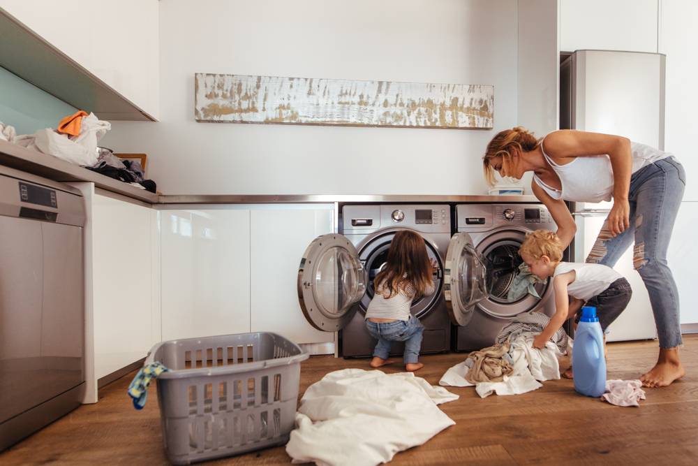Types of washing machines washer and dryer set and woman with children in the room