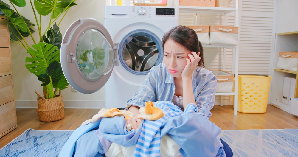Washer dryer combo experiences tired woman with clothes 1