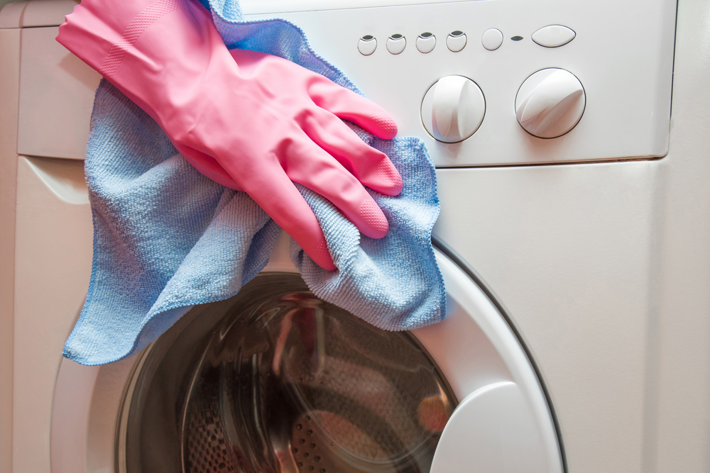 Washing machine maintenance hand cleaning washing machine