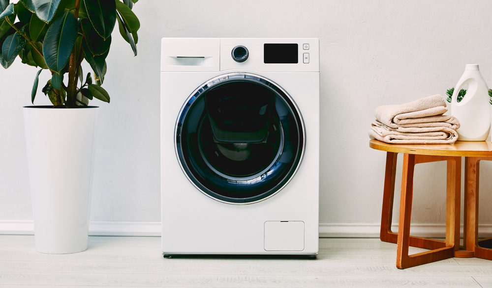 Whirlpool washing machine modern washing machine in the light room e1690963541808